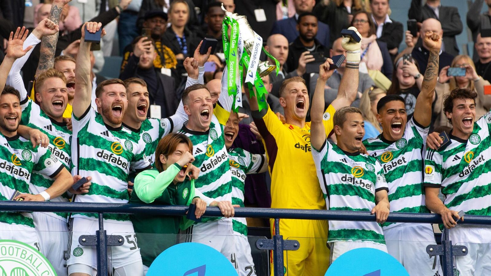 Callum McGregor and Joe Hart lift the Scottish Cup following Celtic